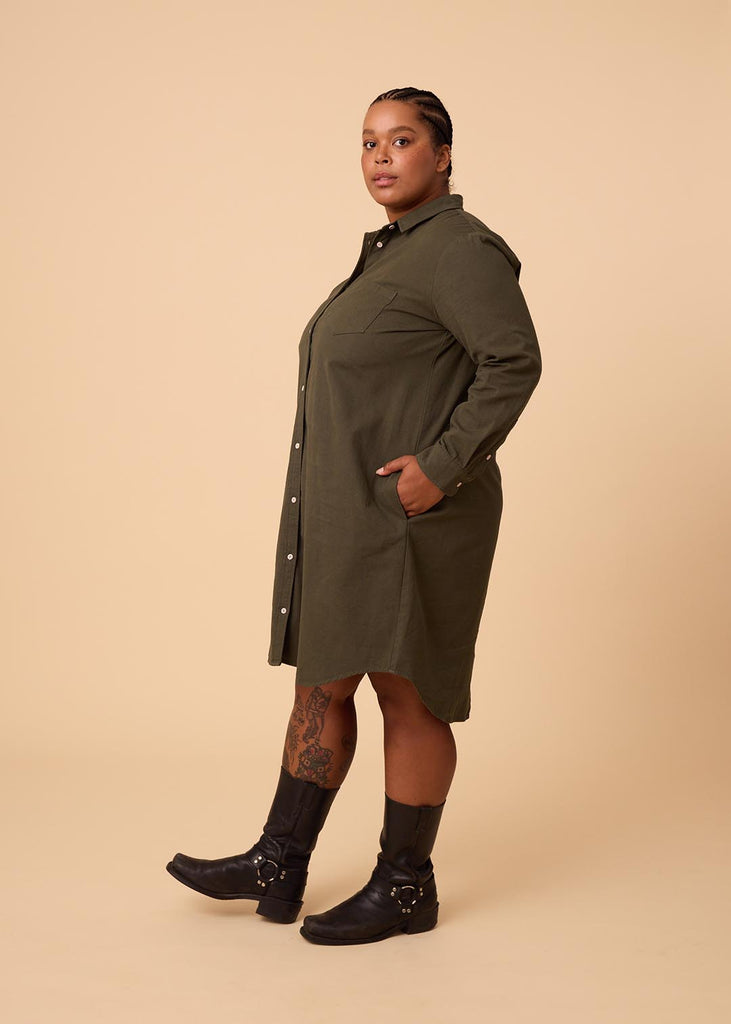 plus size person in an olive green shirt dress