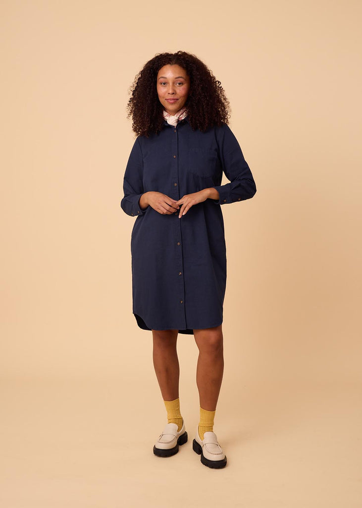 straight size woman in a navy shirt dress