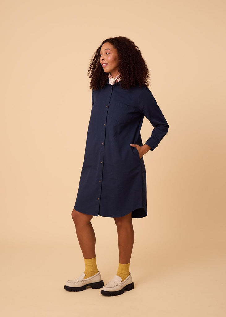 straight size woman in a navy shirt dress