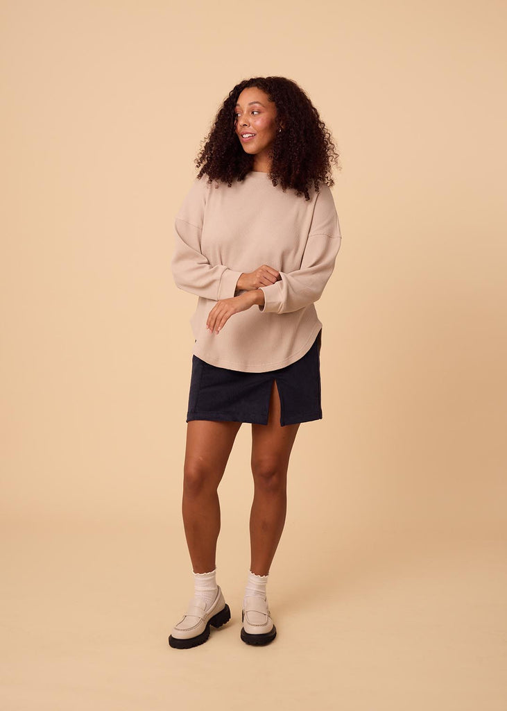 straight size woman wearing cream long sleeve waffle top