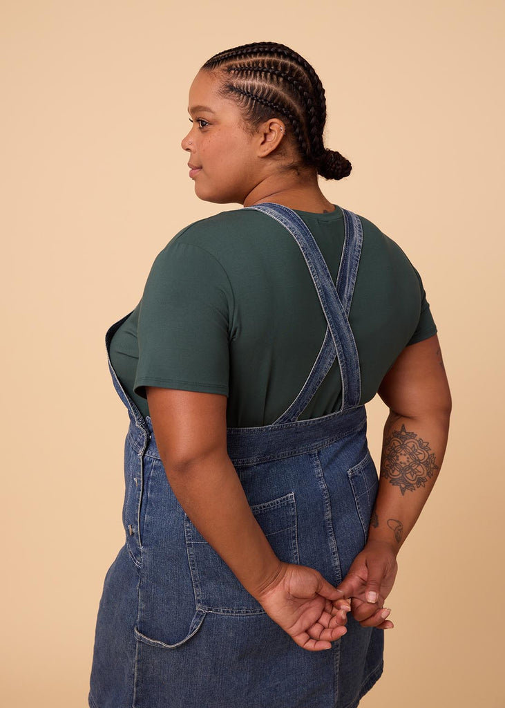 plus size woman in a deep green tee shirt