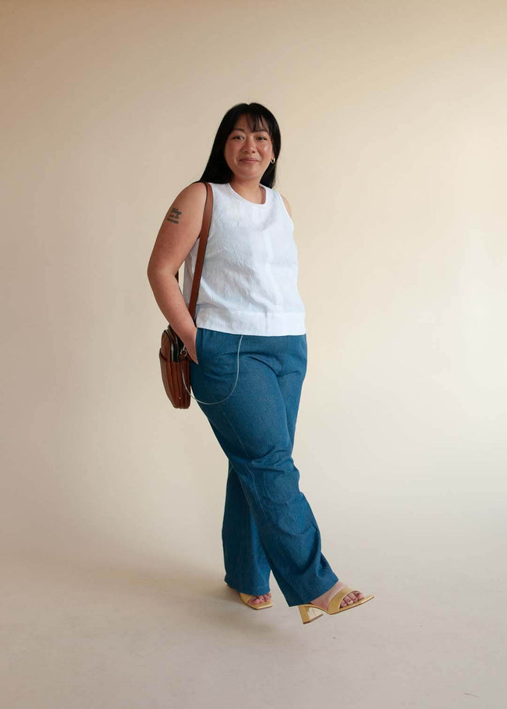 mid size woman wearing wide leg denim pants