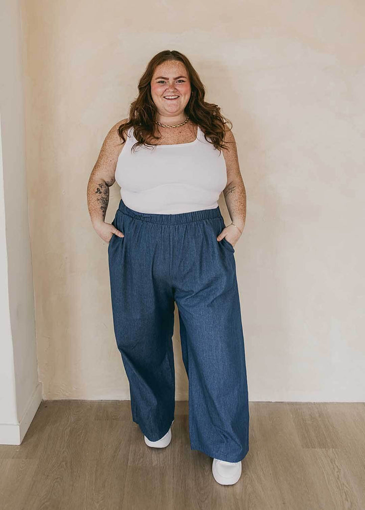 plus size woman wearing wide leg denim pants