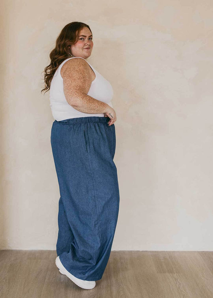 plus size woman wearing wide leg denim pants